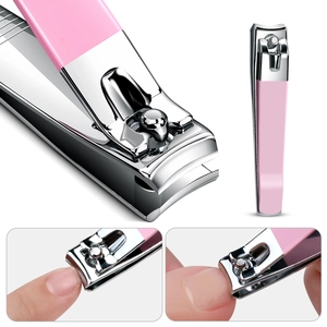 Close-up of pink stainless steel nail clipper showing usage on fingernail edge