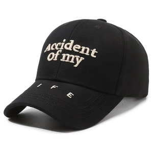 Classic black cotton baseball cap with cream 'accident of my LIFE' embroidery