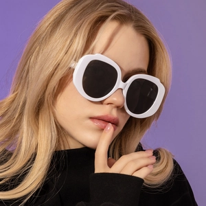 Fashionable oversized round sunglasses with thick white frame and black UV lenses