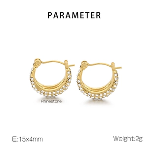Detailed macro view of gold paved earrings with clear rhinestones measuring 15x4mm