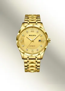 Detail of gold automatic watch with diamond markers and date window on golden sunray dial