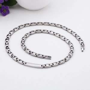 Close-up of a silver titanium steel H-link chain necklace with a polished flat bar plate