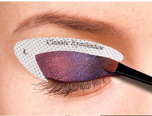 Classic eyeshadow stencil application showing precise makeup positioning with a soft brush