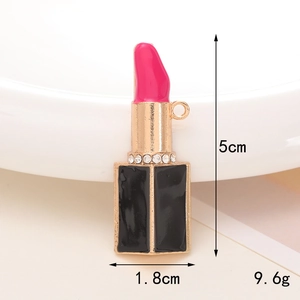 Detailed view of pink lipstick pendant with rhinestones for DIY shoe charms and jewelry