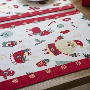 Christmas placemat with red Santa Claus jacquard patterns on wooden table background