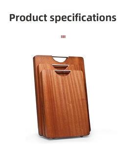 Three-piece solid ebony wood cutting board set with metal handles on white background