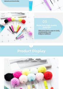 Detail of colorful plastic beaded pens with fluffy faux fur pom poms and rhinestones