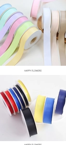 Close-up of matte polyester ribbon rolls in various macaron colors for gift wrapping