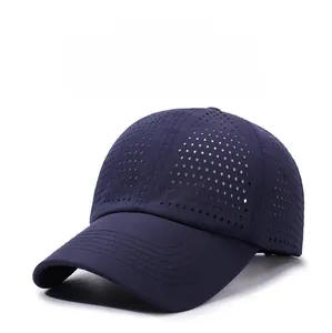 Detailed laser-cut breathable perforations on a quick-dry navy blue baseball cap