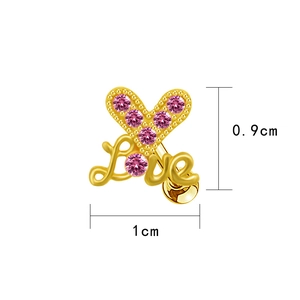 Macro detail of gold heart Love earring with pink rhinestones and 0.9cm x 1cm dimensions