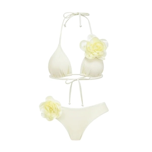 Creamy white halter bikini set featuring 3D floral accents on triangle top and side-tie bottom