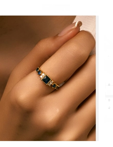Macro shot of a vintage S925 silver ring featuring blue sapphire and baguette diamonds