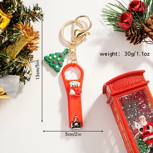 Detailed view of Christmas nail clipper keychain with dimensions 5x13cm and 30g weight