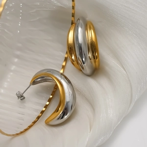 Two-tone C-shape hoop earrings in polished gold and silver finish for women