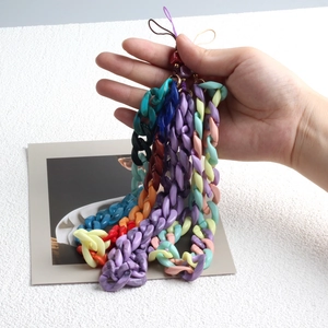 Close-up of colorful acrylic phone lanyards in purple, pink, and blue beads