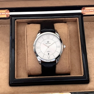 Close-up of a white quartz men's watch with leather strap in a premium gift box