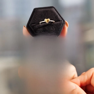 Close-up of S925 sterling silver heart ring with velvet jewelry box and gift card
