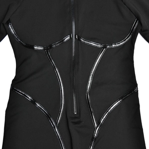 Close-up of black body-shaping bodysuit featuring front zipper and faux leather piping