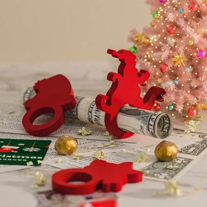 Red Christmas silhouette napkin rings and festive holiday decor set on display