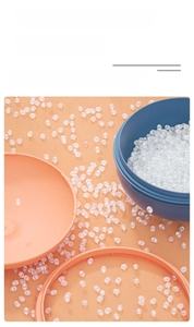 Detail showing non-toxic DIY craft plastic beads in blue and orange containers