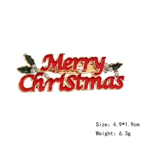 Christmas tree brooch with Merry Christmas lettering, gold metal with red enamel and rhinestones