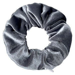 Detailed view of grey velvet tie-dye scrunchie showing fabric texture and natural pleats