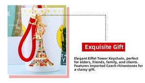 Detailed shot of Eiffel Tower keychain with colorful rhinestones and red woven rope