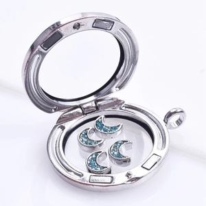 Silver round floating charm locket with blue crystal crescent moon charms inside