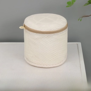 Macro shot of 16x16cm beige honeycomb mesh bra laundry bag with zipper and handle