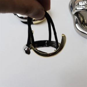 Detail of high-elasticity black hair ties featuring gold and silver alloy hook charms