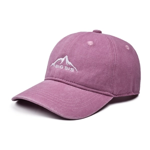 Close-up of BIG SIS embroidery and mountain icon on washed cotton baseball cap