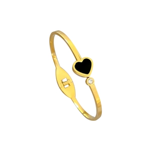 Gold-plated stainless steel bangle with black heart charm and small zircon stone