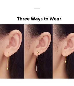 Detailed macro view showing three different wearing styles for gold ear threader earrings