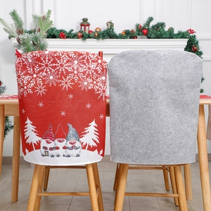 Christmas chair covers featuring gnome and snowflake patterns for festive dining decor