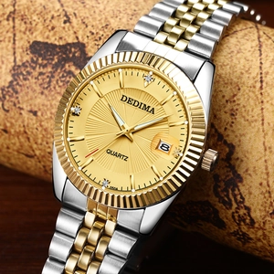 Close-up of champagne gold sunray dial watch with fluted bezel and date window