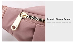 Detail of premium gold metal zipper with Fancy logo on pink nylon waist bag fabric