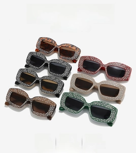 Collection of oversized rhinestone cat eye sunglasses in various fashion colors and patterns