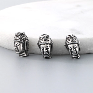 Three silver stainless steel Buddha head spacer beads for DIY jewelry making and crafts