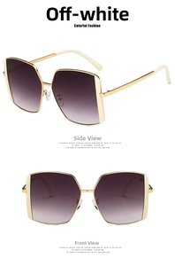 Detail of off-white oversized square sunglasses with gold metal frames and gradient lenses