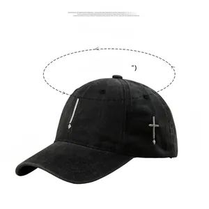 Detailed view of black cotton baseball cap showing cross embroidery and size specifications