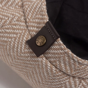 Classic herringbone newsboy cap with vintage metal U.S.A style button and leather trim