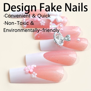 Faux ongles dégradés roses avec pointes French blanches, nœuds 3D et détails de perles