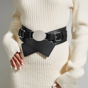 Women's black leather wide waist belt with a large round silver metal buckle for dresses