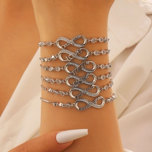 Detailed view of layered infinity bracelets with Daughter, Mom, and Love silver inscriptions