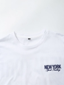Detail of white cotton T-shirt neckline with M size tag and New York graphic print