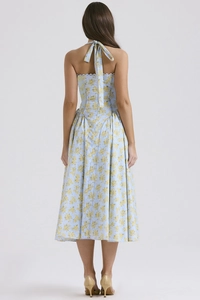 Back view of summer floral dress with neck tie and criss-cross straps detail