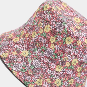 Close-up of fabric texture and stitching on a reversible floral pattern sun hat