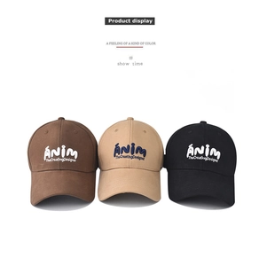 Detailed embroidery on classic washed cotton baseball caps in brown, beige, and black