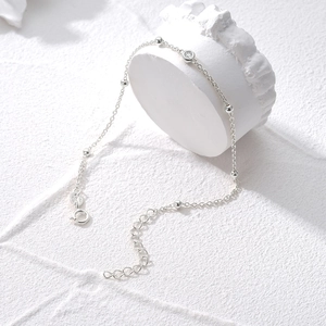Detailed close-up of S925 sterling silver beaded bracelet with a sparkling zircon stone