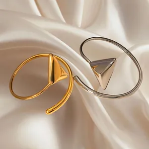 Minimalist 18k gold and silver stainless steel open bangle set with geometric pyramid tips
